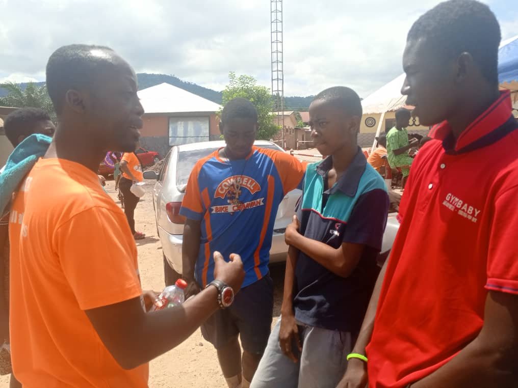 A picture of Emmanuel Djormi- Amanor advising young guys